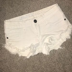 Distressed white short shorts